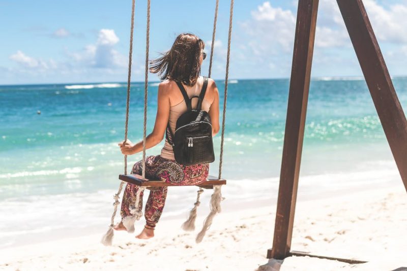 woman on a beach swing