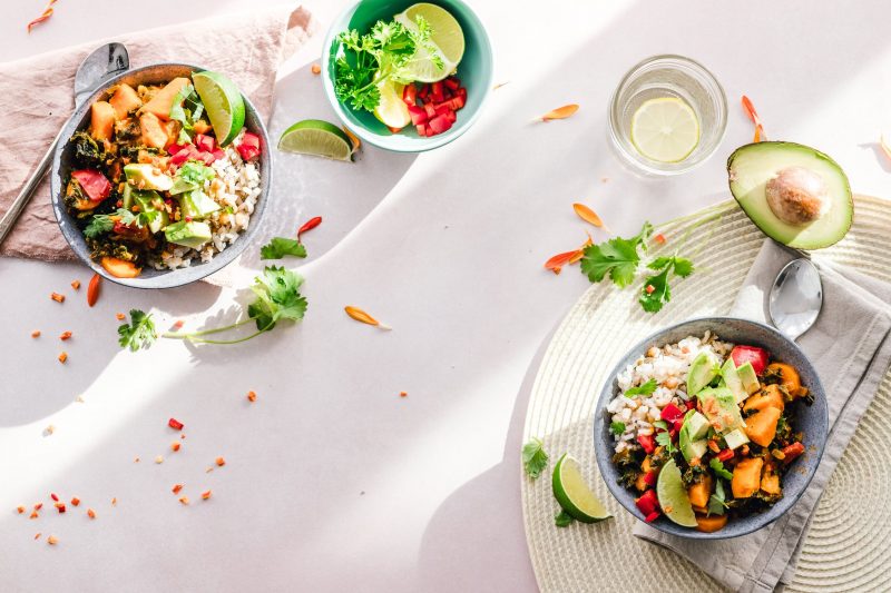 healthy foods in bowls on table with table cloth