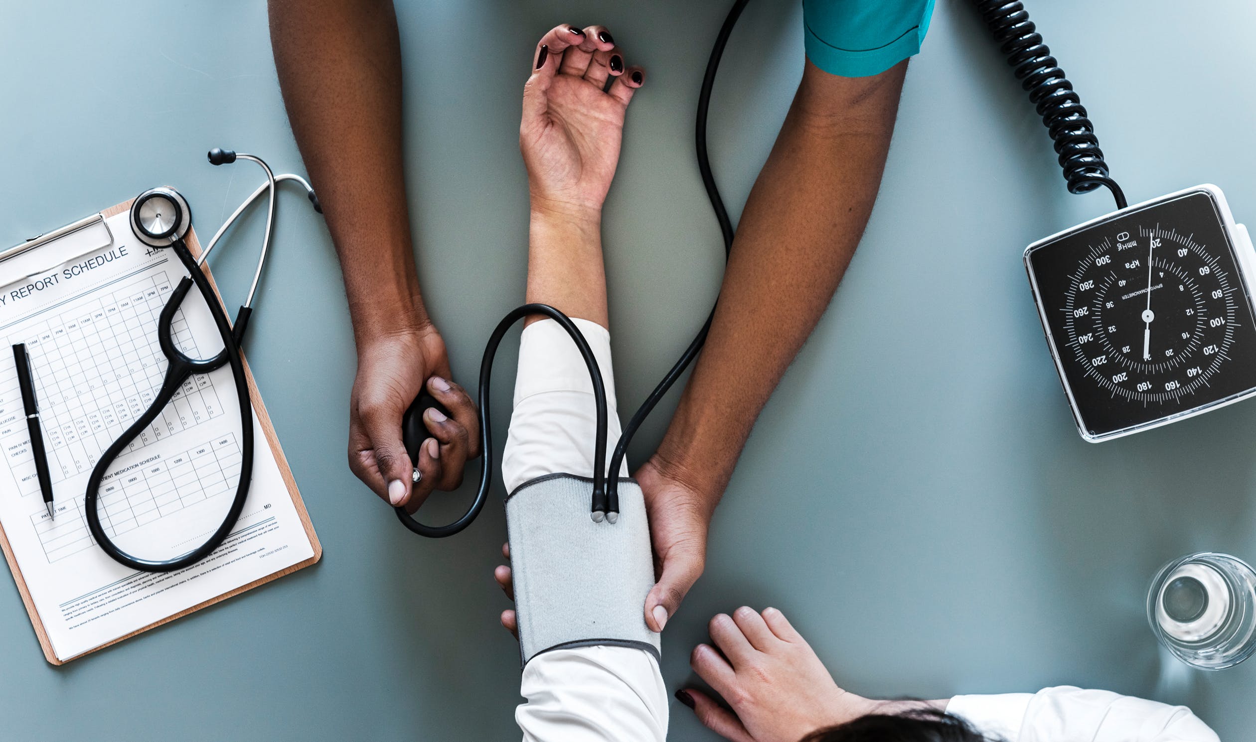 doctor taking blood pressure 