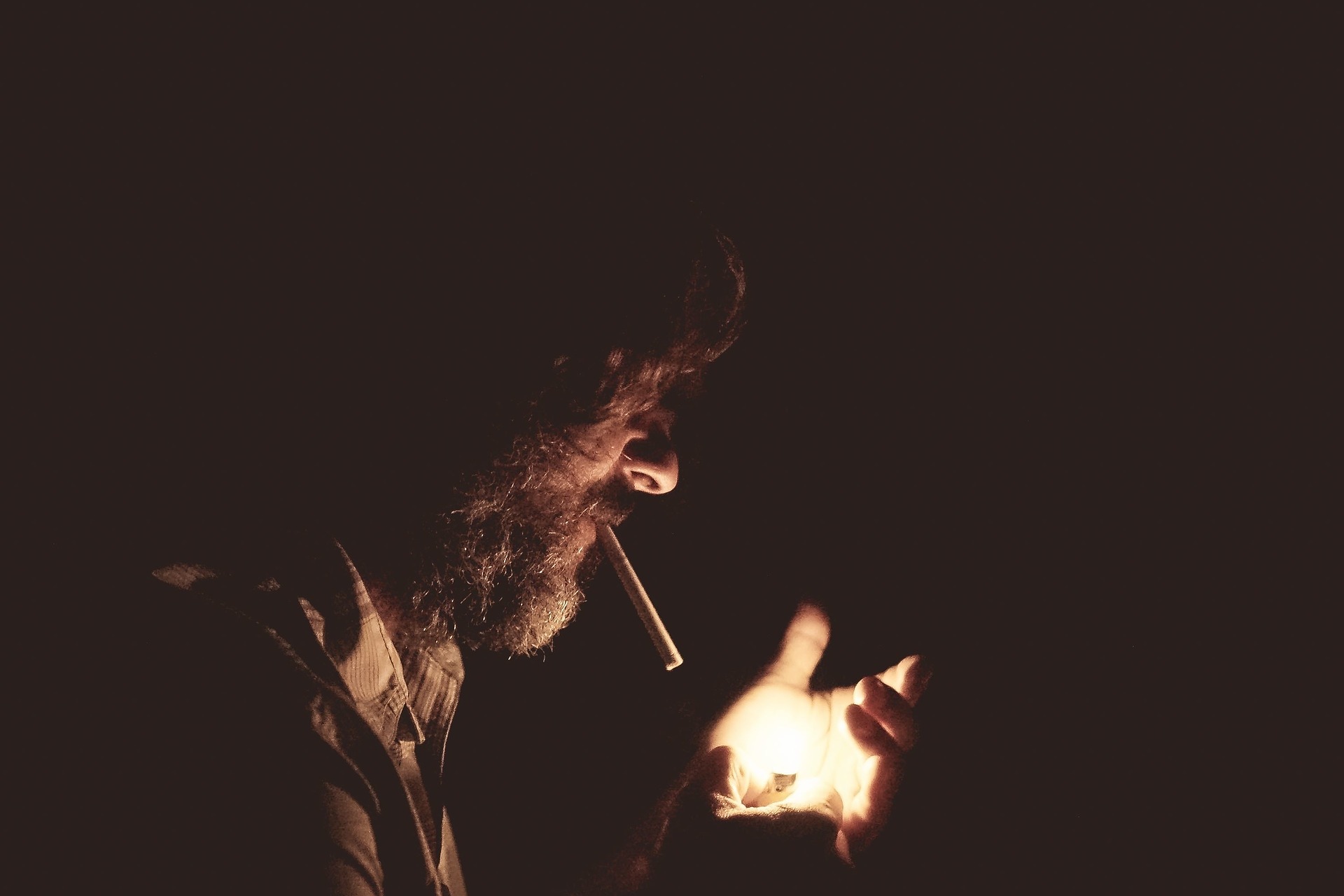dramatic man smoking darkness